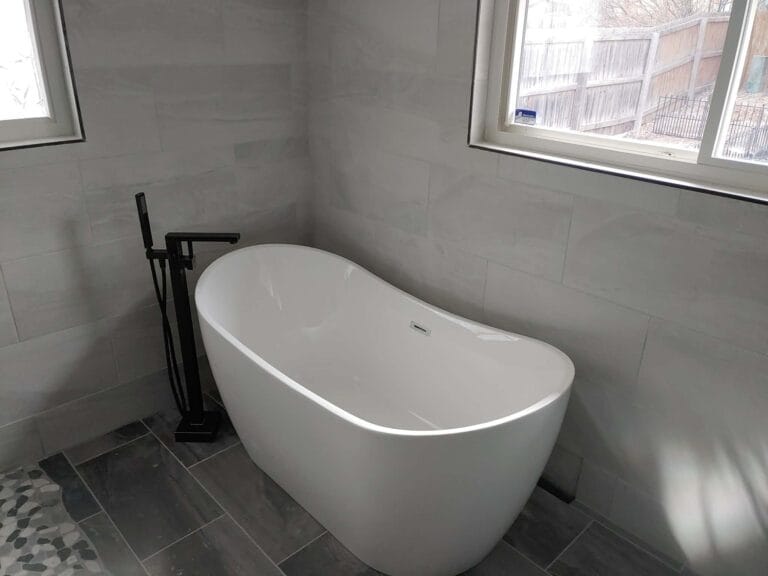 Gallery | Imperial Plumbing LLC Freestanding bathtub installed in a remodeled bathroom