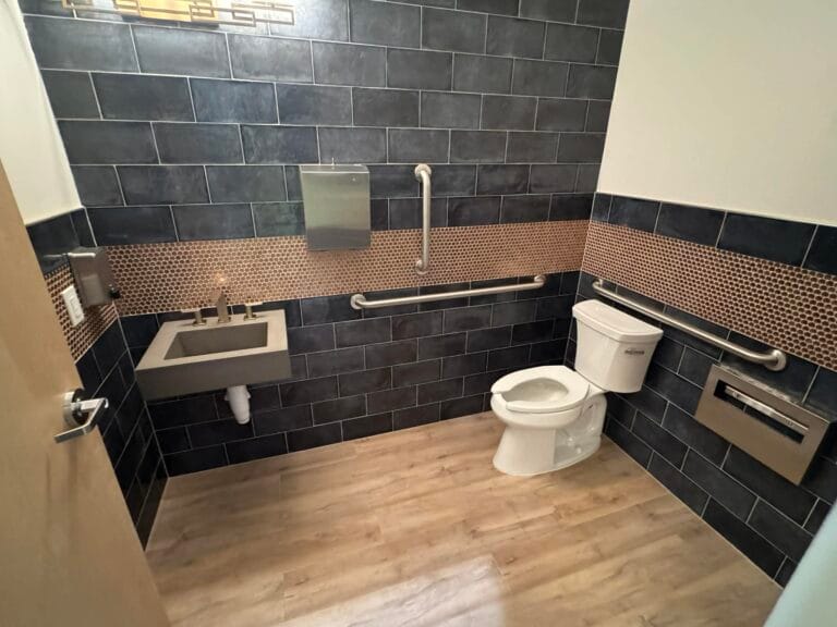 Gallery | Imperial Plumbing LLC Finished commercial restroom with toilet and wall-hung sink