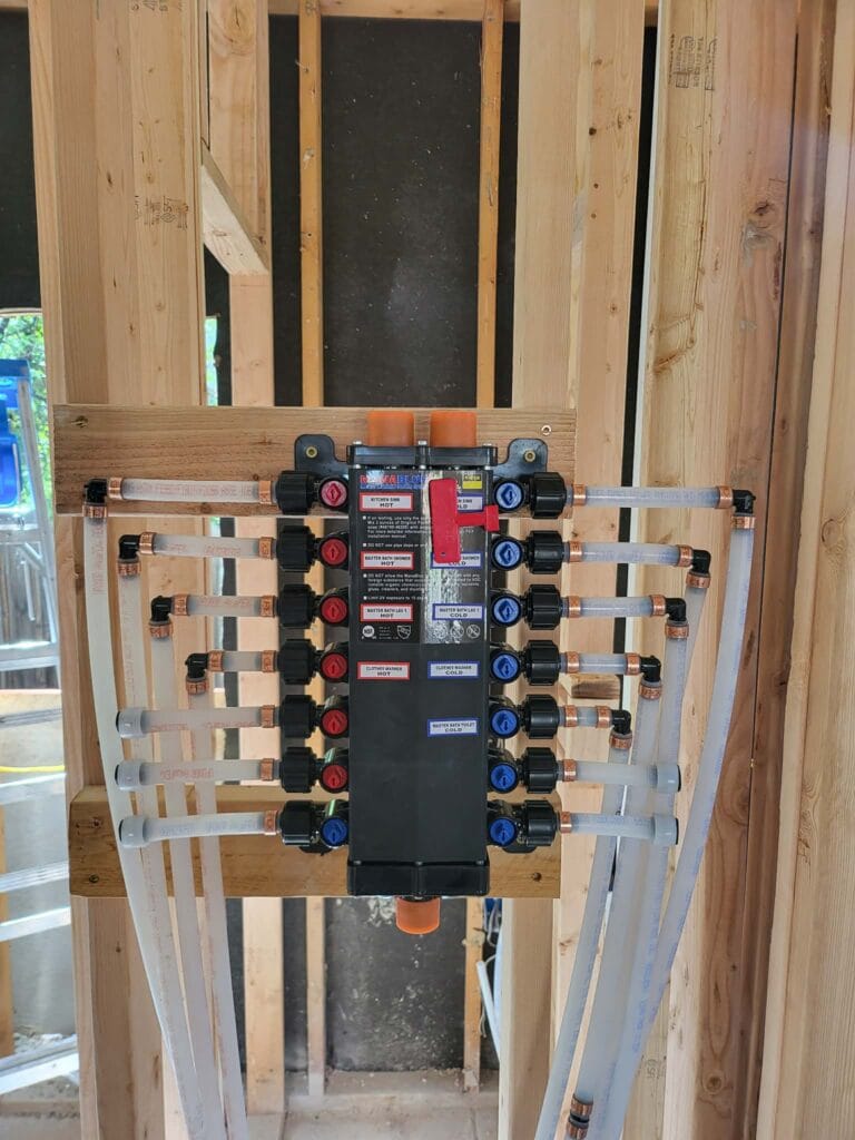Gallery | Imperial Plumbing LLC PEX manifold installed in a framed wall
