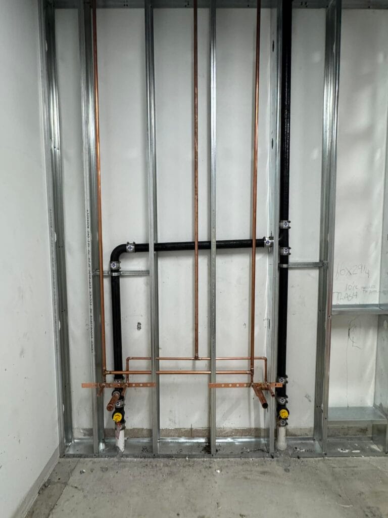 Gallery | Imperial Plumbing LLC Copper water lines installed in a metal-stud wall