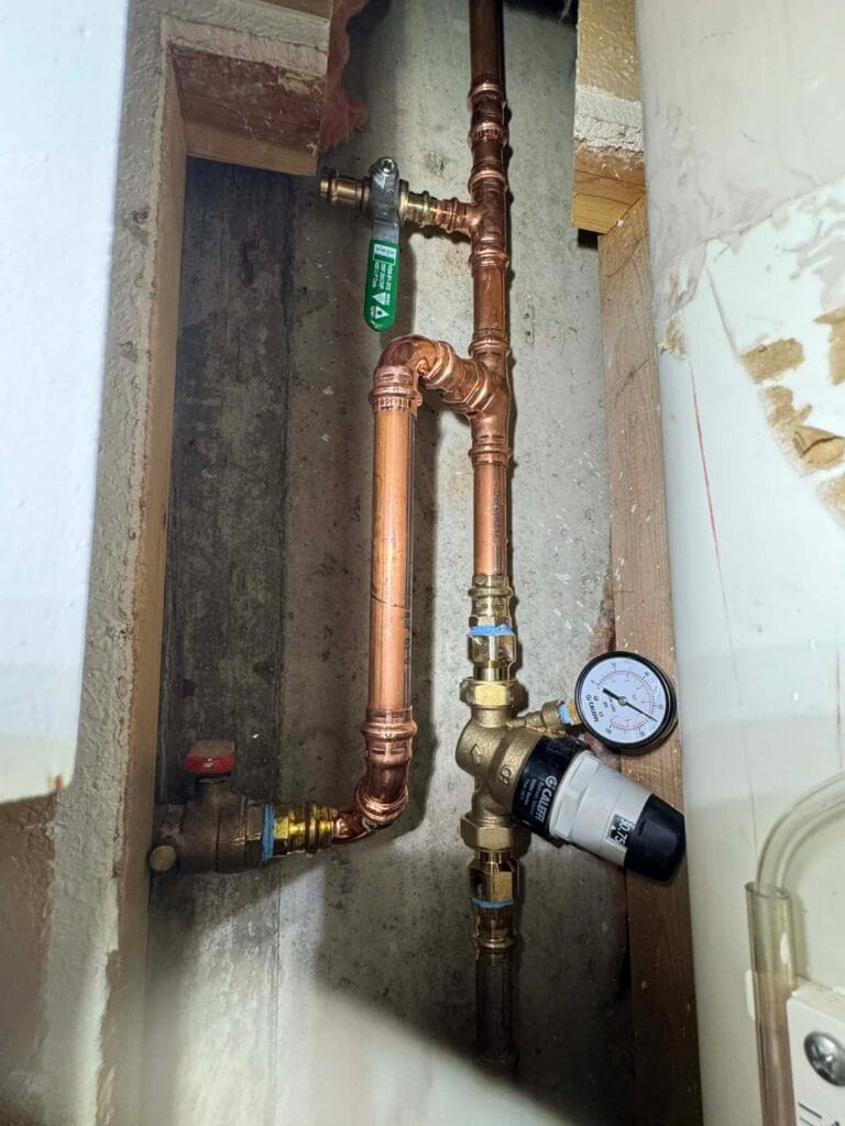 Gallery | Imperial Plumbing LLC Copper water line with pressure gauge during a pressure test