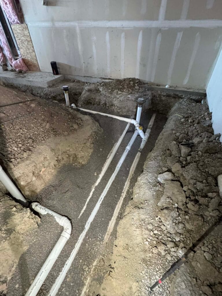 Gallery | Imperial Plumbing LLC Underground PVC drain lines in an excavated slab