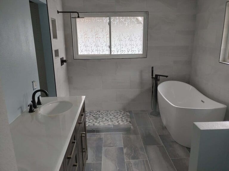 Gallery | Imperial Plumbing LLC Modern bathroom remodel with freestanding tub and vanity