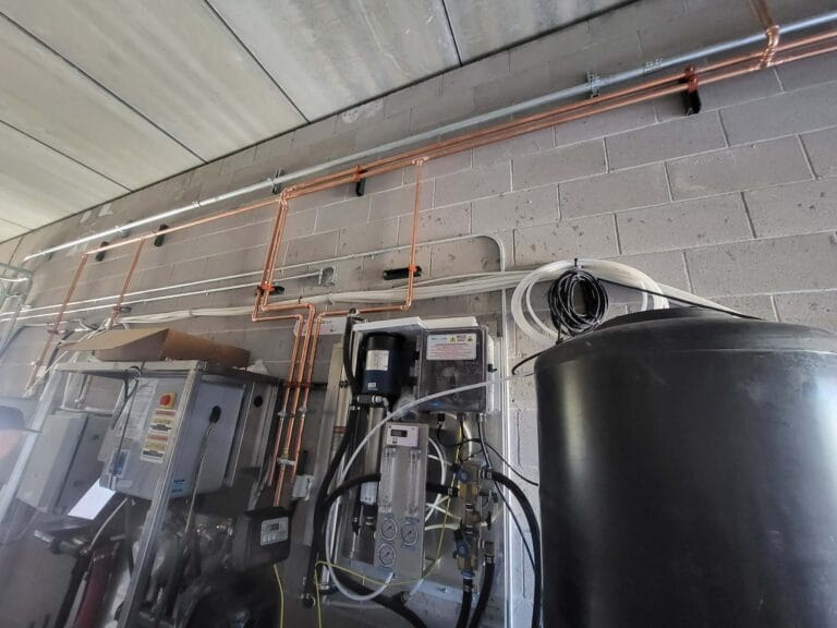 Gallery | Imperial Plumbing LLC Water heater and copper piping in a utility room